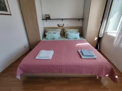 Krevet ili kreveti u jedinici u objektu Apartments - 3 A beautiful apartment with a sea view