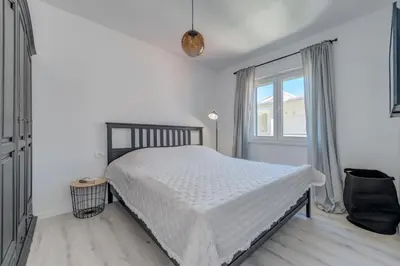 Krevet ili kreveti u jedinici u objektu Beachfront apartments