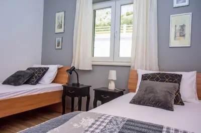 Krevet ili kreveti u jedinici u objektu VILLA MASLINA, with private 32m2Pool, panoramic views on 100km coastline, 12 pax