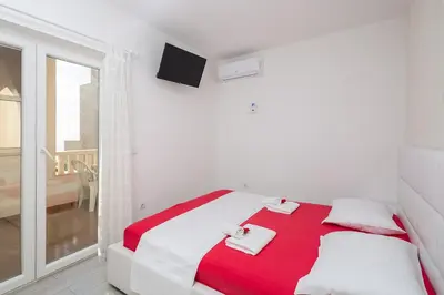 Krevet ili kreveti u jedinici u objektu Apartmani Kaštelančić