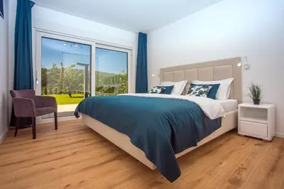 Krevet ili kreveti u jedinici u objektu Villa Agava with heated pool, Jacuzzi, sauna, gym, 4 en-suite bedrooms