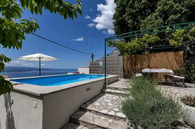 Bazen u objektu Holiday home Marta with heated pool,grill,sea view ili u blizini