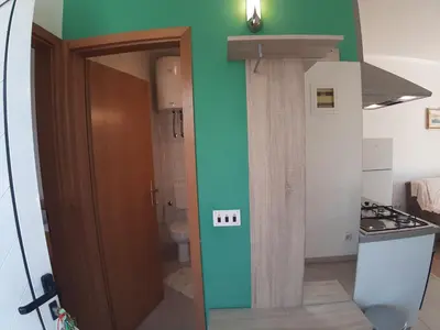 Kuhinja ili čajna kuhinja u objektu Apartments and Rooms Dobrila