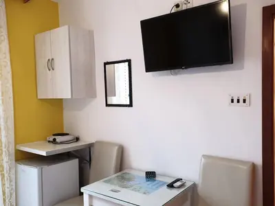 TV i/ili zabavni centar u objektu Apartments and Rooms Dobrila