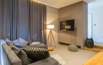 TV i/ili zabavni centar u objektu Gorgeous Home In Katuni