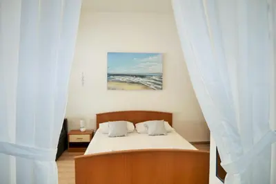 Krevet ili kreveti u jedinici u objektu Apartments Sandy Beach