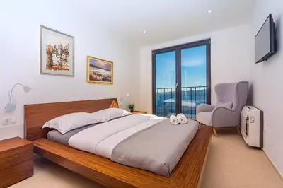 Krevet ili kreveti u jedinici u objektu Villa Mia with private pool, Whirlpool, gym, sauna, seaviews