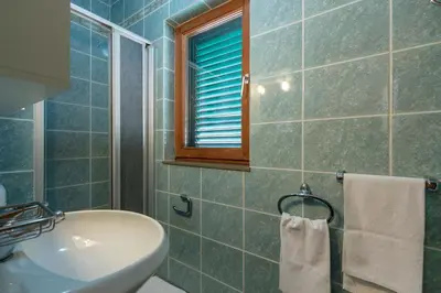 Kupaonica u objektu Apartment Aria with private heated pool