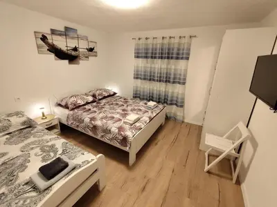 Krevet ili kreveti u jedinici u objektu Guesthouse Eljuga Family