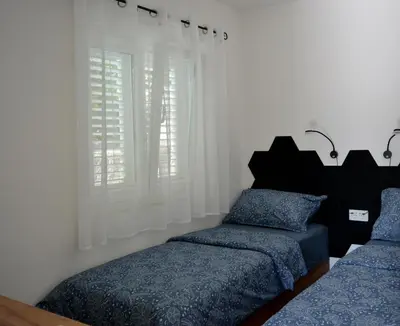 Krevet ili kreveti u jedinici u objektu Apartment on the beach - Nemira, Omiš