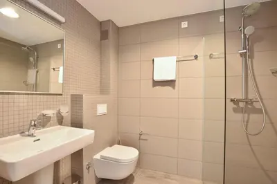 Kupaonica u objektu Luxury, seafront Villa IVAN with heated pool only 100m from beach