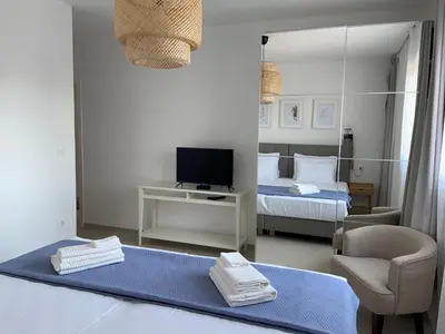 Krevet ili kreveti u jedinici u objektu Exclusive Seafront Suite with jacuzzi