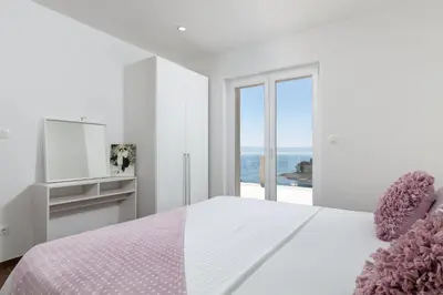 Krevet ili kreveti u jedinici u objektu APARTMENTS BAKA