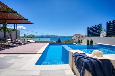 Bazen u objektu LUXURY VILLA PARADISE 120m from sandy beach, heated pool, billiard, max 12 pax ili u blizini