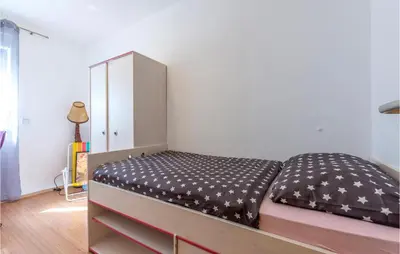 Krevet ili kreveti u jedinici u objektu 3 Bedroom Nice Apartment In Duce