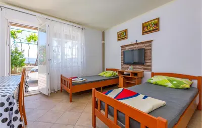 TV i/ili zabavni centar u objektu Awesome Apartment In Duce With Wifi