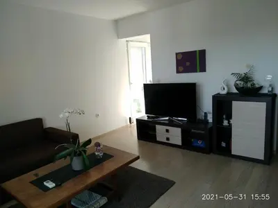 TV i/ili zabavni centar u objektu Private Pool and Sea View Apartment