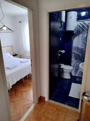 Krevet ili kreveti u jedinici u objektu ROOMS LUCE 1 & SUPETAR