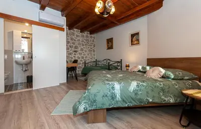 Krevet ili kreveti u jedinici u objektu New Villa OLE, stone house, sea view, jacuzzi