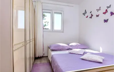Krevet ili kreveti u jedinici u objektu 2 Bedroom Beautiful Apartment In Podstrana