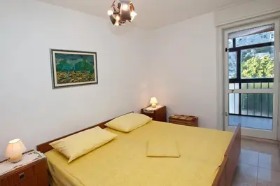 Krevet ili kreveti u jedinici u objektu Sara apartment Punta Omis near sandy beach