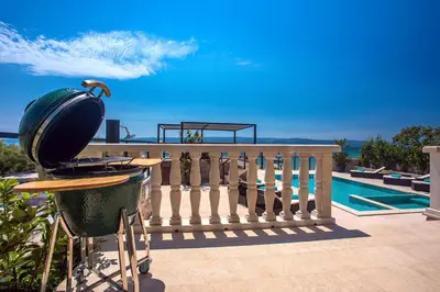 Bazen u objektu Beachfront Villa Draga with 32sqm private, heated pool, 4 bedrooms, sea view ili u blizini