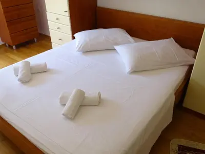 Krevet ili kreveti u jedinici u objektu 6 pax Apertment ON THE BEACH with Terrace, Sea view, Garden, Parking ensured, first floor