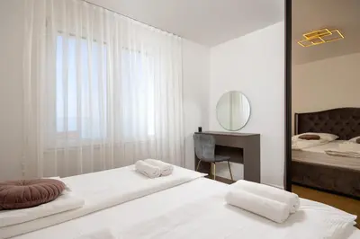 Krevet ili kreveti u jedinici u objektu Seaside Luxury Apartment Tanita