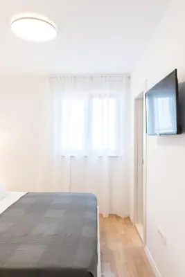 TV i/ili zabavni centar u objektu Lion's Beach Starlight Apartment