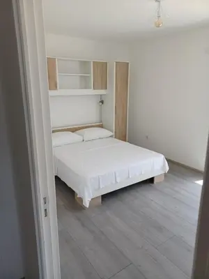 Krevet ili kreveti u jedinici u objektu APARTMANI JELIĆ