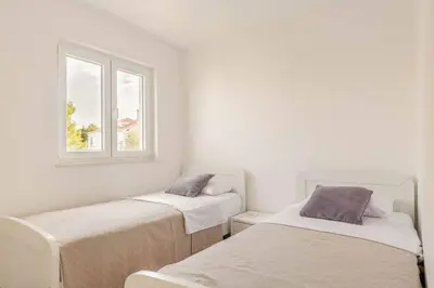 Krevet ili kreveti u jedinici u objektu Garden house Sutivan