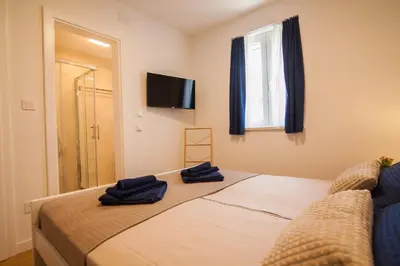 Krevet ili kreveti u jedinici u objektu Apartment CasArosa - Free Private Parking