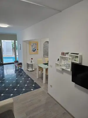 TV i/ili zabavni centar u objektu Luksuzna villa sa privatnim unutarnjim bazenom Villa Garden