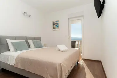 Krevet ili kreveti u jedinici u objektu Sunny Hill Apartments with rooftop pool