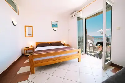 Krevet ili kreveti u jedinici u objektu Apartment in Due with sea view, balcony, air conditioning, WiFi 4167-1