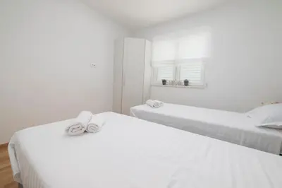 Krevet ili kreveti u jedinici u objektu LuSi Apartman Makarska