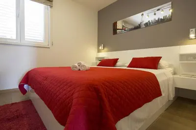 Krevet ili kreveti u jedinici u objektu Apartments by the sea Makarska - 20587