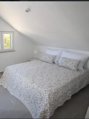 Krevet ili kreveti u jedinici u objektu Villa Luce del Sole Apartment