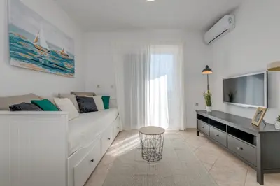 TV i/ili zabavni centar u objektu Apartment Beach